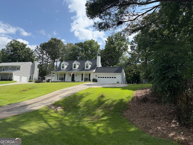 3694 Jay Bird Aly, Peachtree Corners, GA 30092 - new england style home featuring a chimney, concrete driveway, a front lawn, and an attached garage