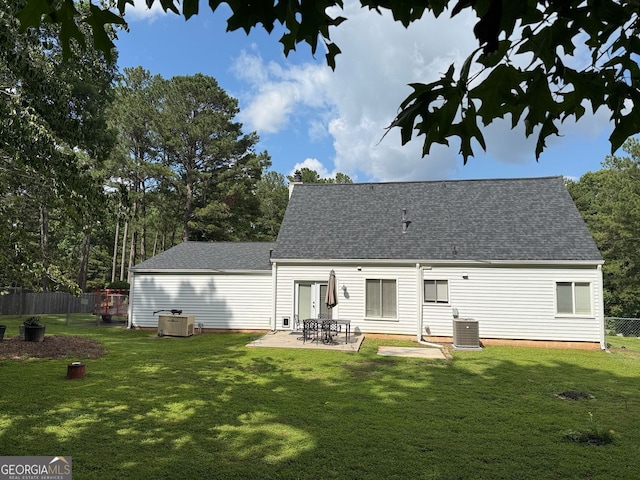 3694 Jay Bird Aly, Peachtree Corners, GA 30092 - back of property featuring roof with shingles, cooling unit, a patio, and a chimney