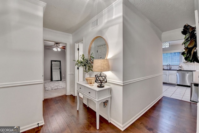 3694 Jay Bird Aly, Peachtree Corners, GA 30092 - corridor featuring hardwood / wood-style flooring, a textured ceiling, ornamental molding, baseboards, and a sink
