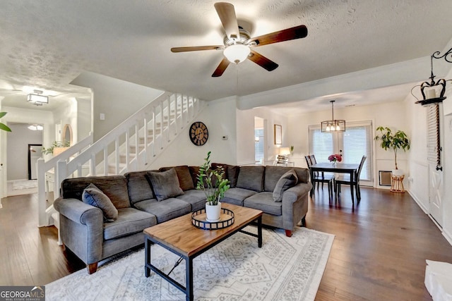 3694 Jay Bird Aly, Peachtree Corners, GA 30092 - living room featuring stairway, wood finished floors, ceiling fan, a textured ceiling, and baseboards
