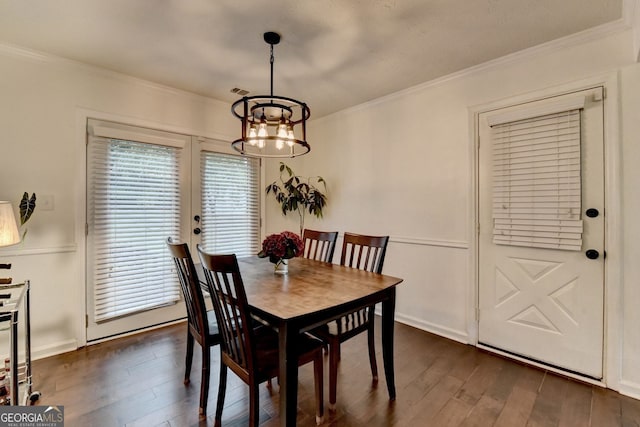 3694 Jay Bird Aly, Peachtree Corners, GA 30092 - dining space with ornamental molding, a chandelier, and dark wood-type flooring