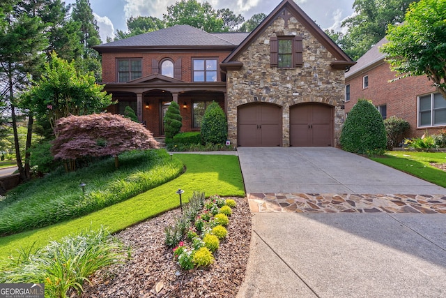1984 Mendenhall Cir, Atlanta, GA 30341 - view of front facade featuring a garage, concrete driveway, stone siding, and a front yard