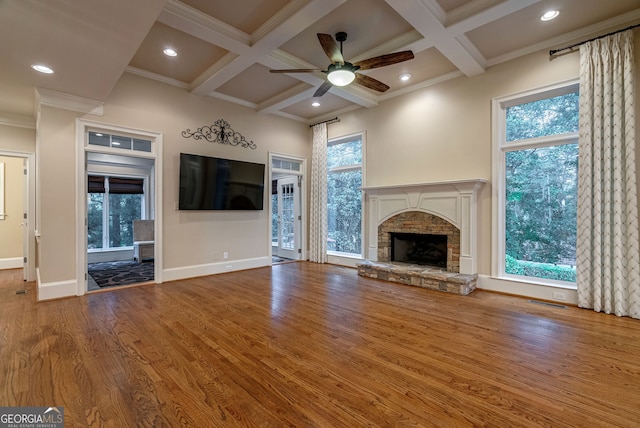 1984 Mendenhall Cir, Atlanta, GA 30341 - unfurnished living room featuring wood finished floors, a ceiling fan, coffered ceiling, healthy amount of natural light, and beamed ceiling