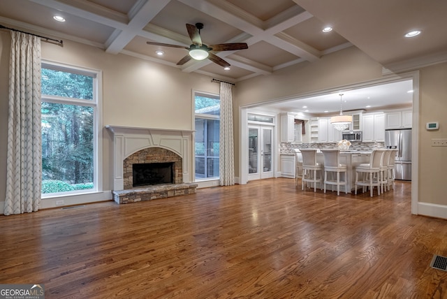 1984 Mendenhall Cir, Atlanta, GA 30341 - living room featuring wood finished floors, beamed ceiling, a ceiling fan, a fireplace, and recessed lighting