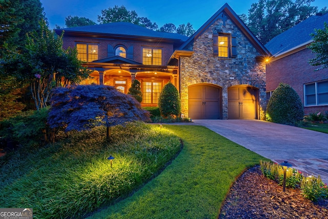 1984 Mendenhall Cir, Atlanta, GA 30341 - view of front of property with stone siding, a garage, driveway, and a front lawn