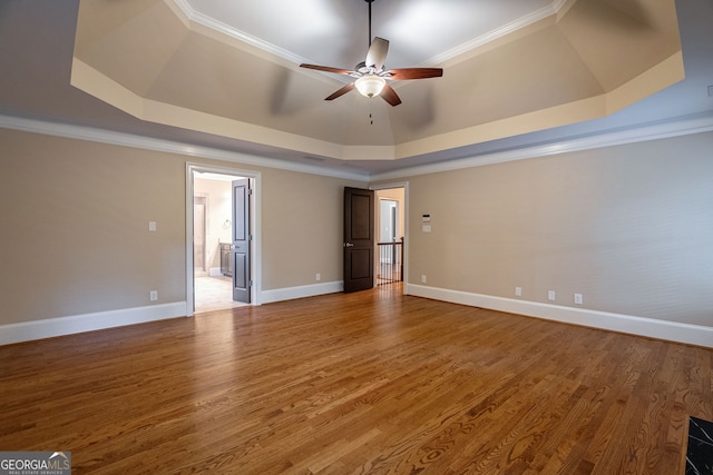 1984 Mendenhall Cir, Atlanta, GA 30341 - unfurnished room featuring a tray ceiling, a ceiling fan, light wood-style flooring, and ornamental molding