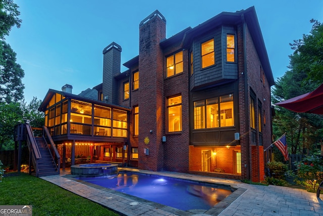1984 Mendenhall Cir, Atlanta, GA 30341 - rear view of house with a chimney, brick siding, stairway, and a patio