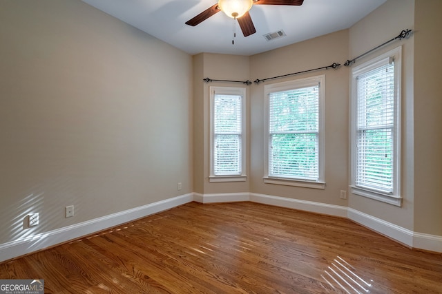 1984 Mendenhall Cir, Atlanta, GA 30341 - empty room with wood finished floors, ceiling fan, and plenty of natural light