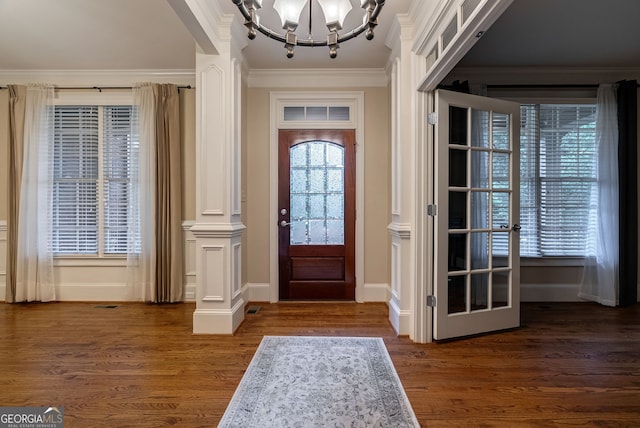 1984 Mendenhall Cir, Atlanta, GA 30341 - entrance foyer featuring a chandelier, decorative columns, dark wood-type flooring, crown molding, and french doors