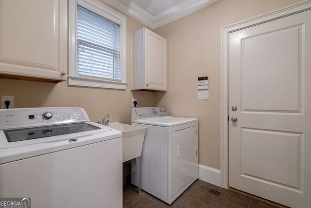 1984 Mendenhall Cir, Atlanta, GA 30341 - washroom featuring cabinet space, washing machine and clothes dryer, ornamental molding, and dark tile patterned flooring