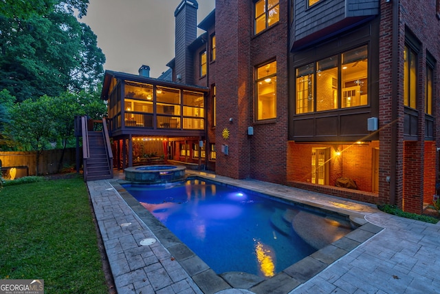 1984 Mendenhall Cir, Atlanta, GA 30341 - view of swimming pool with stairs, a patio area, a pool with connected hot tub, and a sunroom