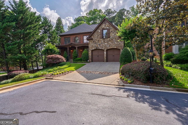 1984 Mendenhall Cir, Atlanta, GA 30341 - view of front of home with driveway, stone siding, and a garage
