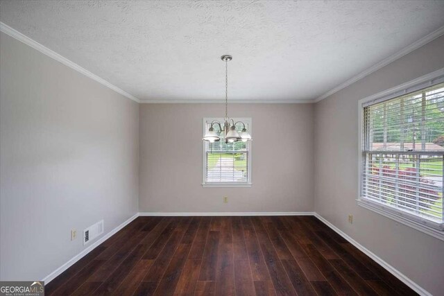 3802 Birchbriar Ct, Decatur, GA 30034 - unfurnished room with a chandelier, baseboards, dark wood-type flooring, a textured ceiling, and crown molding