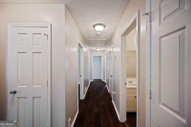 3802 Birchbriar Ct, Decatur, GA 30034 - hallway with attic access, baseboards, dark wood-type flooring, and a textured ceiling