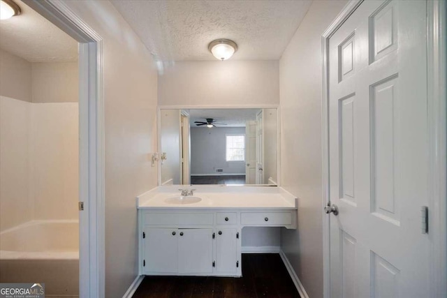 3802 Birchbriar Ct, Decatur, GA 30034 - full bath featuring vanity, a textured ceiling, baseboards, a ceiling fan, and wood finished floors