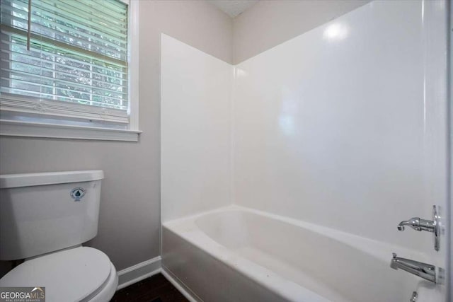 3802 Birchbriar Ct, Decatur, GA 30034 - bathroom featuring baseboards, plenty of natural light, toilet, and washtub / shower combination