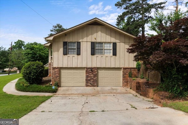 3802 Birchbriar Ct, Decatur, GA 30034 - view of front of property featuring driveway, an attached garage, board and batten siding, and brick siding