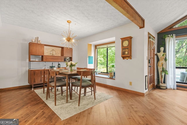 2666 Peachtree Walk, Duluth, GA 30096 - dining space featuring light wood-style floors, a textured ceiling, and a chandelier