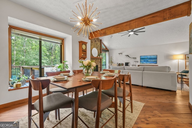 2666 Peachtree Walk, Duluth, GA 30096 - dining room with a textured ceiling, plenty of natural light, wood finished floors, and a chandelier