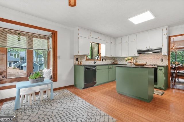 2666 Peachtree Walk, Duluth, GA 30096 - kitchen featuring green cabinets, dishwasher, under cabinet range hood, plenty of natural light, and ornamental molding