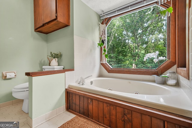 2666 Peachtree Walk, Duluth, GA 30096 - bathroom featuring a whirlpool tub and tile patterned floors