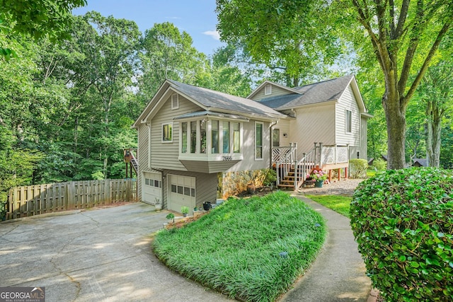 2666 Peachtree Walk, Duluth, GA 30096 - view of front facade featuring concrete driveway, a garage, and roof with shingles