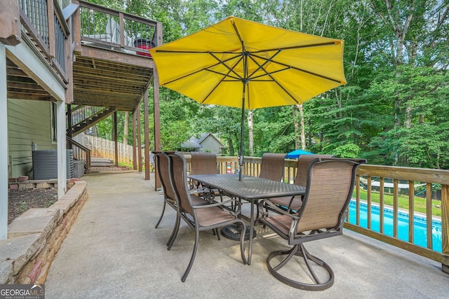 2666 Peachtree Walk, Duluth, GA 30096 - view of patio / terrace featuring stairway, outdoor dining area, an outdoor pool, and view of scattered trees