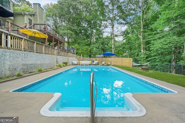 2666 Peachtree Walk, Duluth, GA 30096 - view of swimming pool featuring a fenced backyard, view of wooded area, and a deck