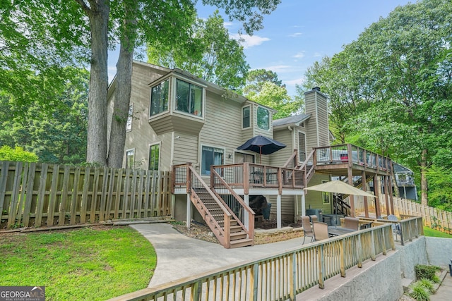 2666 Peachtree Walk, Duluth, GA 30096 - rear view of property with stairway, a deck, a patio, and a chimney