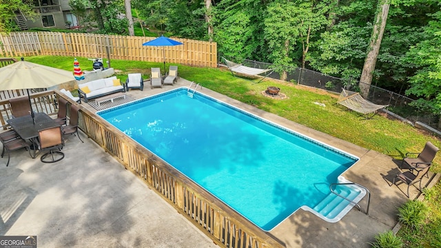 2666 Peachtree Walk, Duluth, GA 30096 - view of swimming pool featuring a fenced backyard, a patio area, and a fire pit