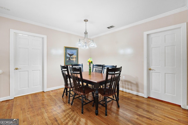 207 Saddle Mountain Rd SE, Rome, GA 30161 - dining area with baseboards, light wood-style flooring, and crown molding