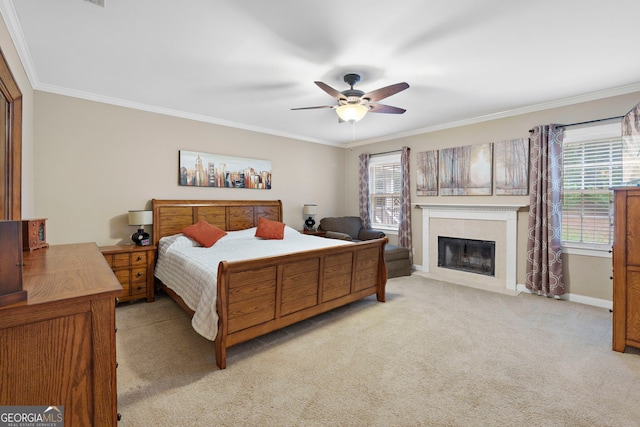 207 Saddle Mountain Rd SE, Rome, GA 30161 - bedroom with crown molding, light colored carpet, a tile fireplace, baseboards, and ceiling fan