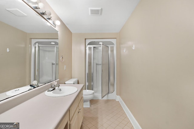207 Saddle Mountain Rd SE, Rome, GA 30161 - bathroom featuring vanity, a shower stall, tile patterned flooring, and toilet