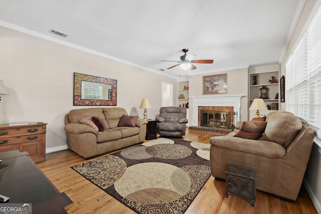 207 Saddle Mountain Rd SE, Rome, GA 30161 - living room featuring ceiling fan, a fireplace, ornamental molding, wood finished floors, and baseboards