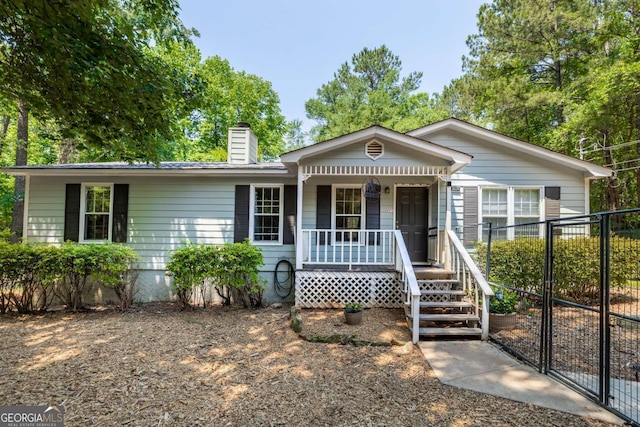 1201 Sid Hunter Rd, Senoia, GA 30276 - ranch-style house featuring a porch and a chimney