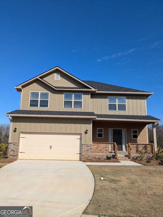 624 Britton Way Lot 67, Macon, GA 31216 - view of front of home featuring a garage, concrete driveway, covered porch, and board and batten siding