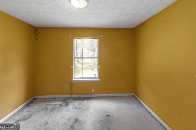 9550 Canvasback Ct, Jonesboro, GA 30238 - empty room with baseboards and a textured ceiling