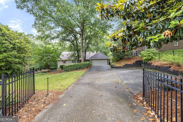 5065 Nesbit Ferry Ln, Atlanta, GA 30350 - view of property hidden behind natural elements featuring a detached garage