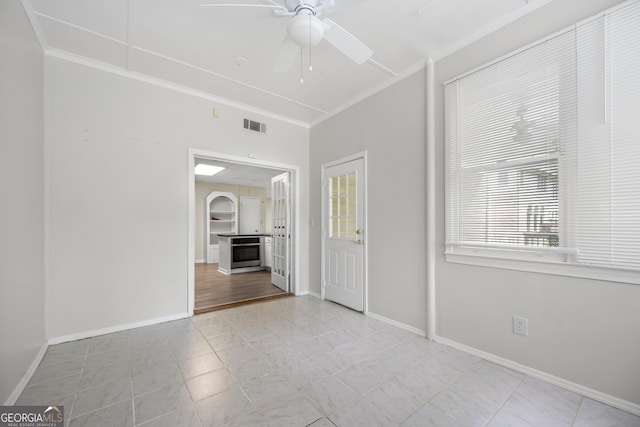 5065 Nesbit Ferry Ln, Atlanta, GA 30350 - tiled spare room with ornamental molding and a ceiling fan