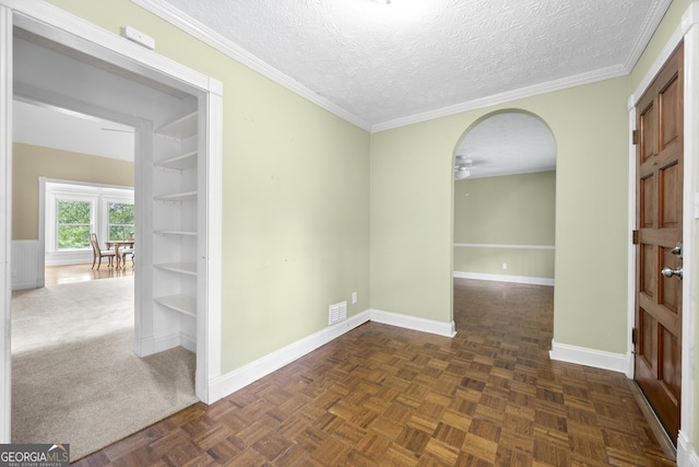5065 Nesbit Ferry Ln, Atlanta, GA 30350 - empty room featuring a ceiling fan, a textured ceiling, arched walkways, and ornamental molding