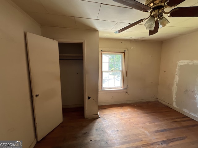 1263 Highland Ave, Macon, GA 31211 - unfurnished bedroom with hardwood / wood-style floors, a closet, and ceiling fan