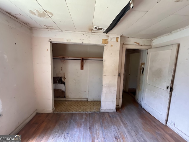 1263 Highland Ave, Macon, GA 31211 - unfurnished bedroom featuring wood finished floors and a closet