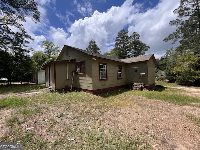 1263 Highland Ave, Macon, GA 31211 - view of side of home featuring a garage