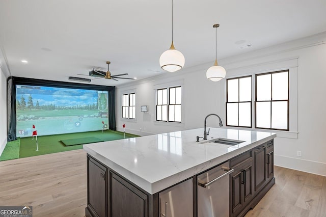 4927 Slaton Dr, Acworth, GA 30101 - kitchen featuring golf simulator, light wood-style flooring, dishwasher, dark brown cabinets, and pendant lighting
