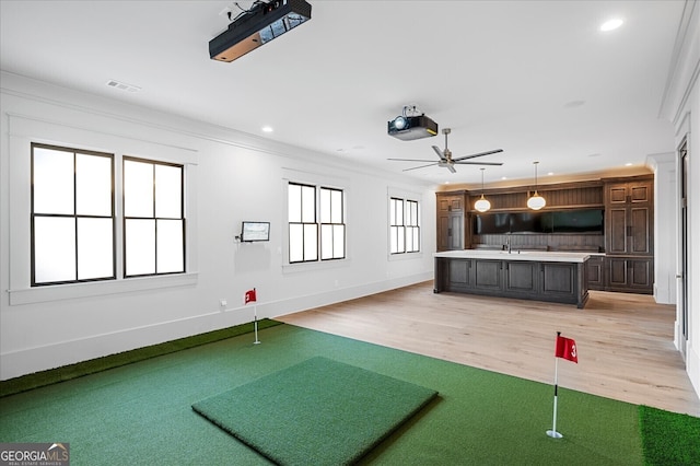 4927 Slaton Dr, Acworth, GA 30101 - rec room with a putting green, ceiling fan, recessed lighting, light wood finished floors, and ornamental molding
