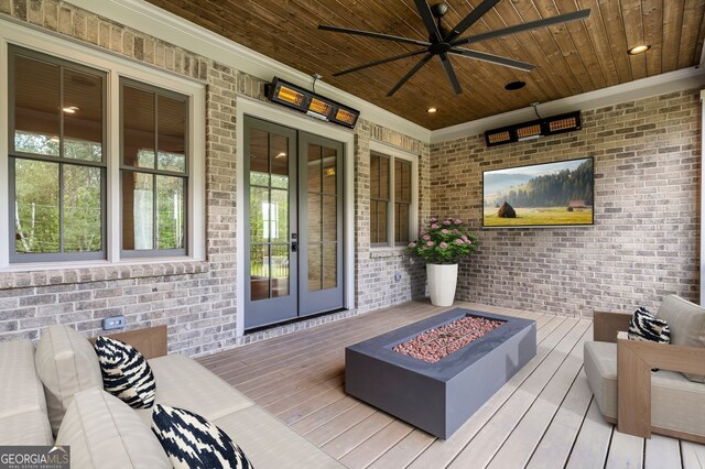 4927 Slaton Dr, Acworth, GA 30101 - wooden terrace with a fire pit, french doors, and a ceiling fan