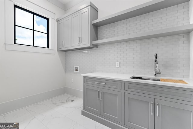 4927 Slaton Dr, Acworth, GA 30101 - laundry area featuring marble finish flooring, hookup for a washing machine, and cabinet space