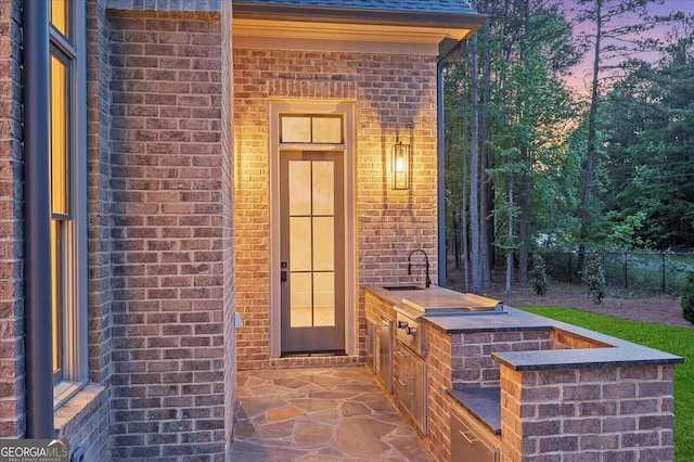 4927 Slaton Dr, Acworth, GA 30101 - property entrance with brick siding and an outdoor kitchen