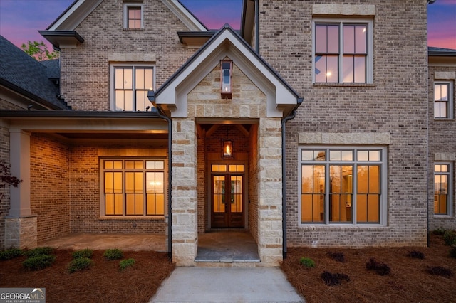 4927 Slaton Dr, Acworth, GA 30101 - entrance to property featuring french doors, stone siding, and brick siding