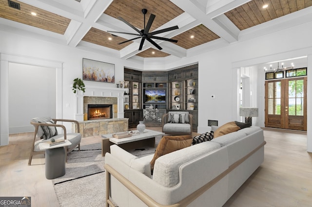 4927 Slaton Dr, Acworth, GA 30101 - living area featuring coffered ceiling, beam ceiling, a fireplace, light wood-type flooring, and a ceiling fan